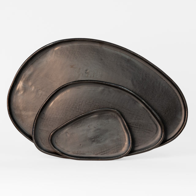 One-of-a-kind metallic black speckled stoneware Amorphous platter set, J Schatz