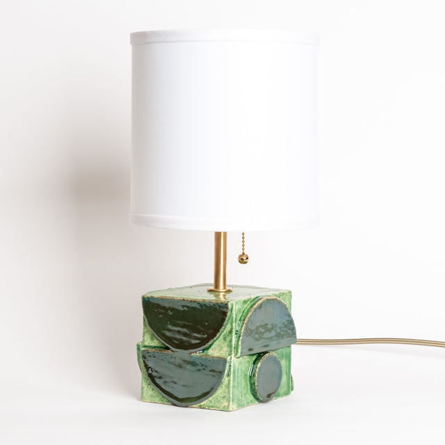 Geometria ceramic table lamp in sage green metallic, side view, J Schatz
