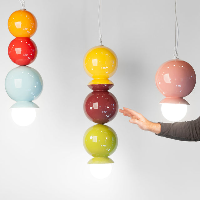 Ceramic Dot Dot Dot pendants in multiple colors, J Schatz.