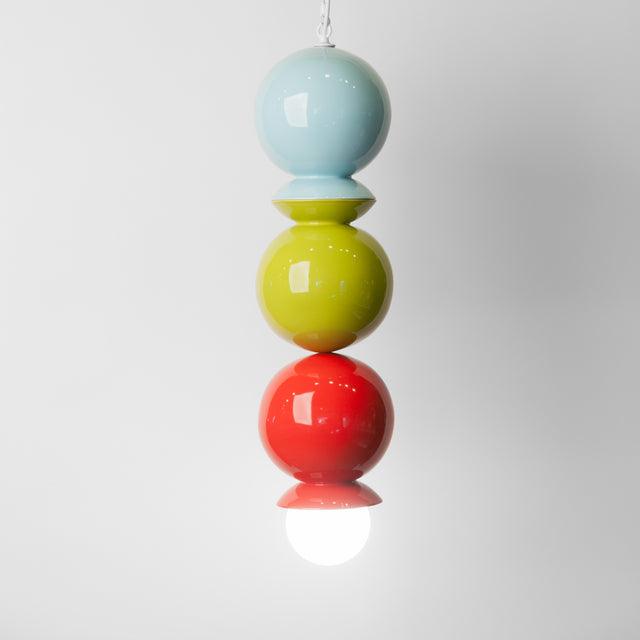Aqua, olive, and red ceramic Dot Dot Dot pendant, J Schatz.