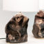 Metallic black ceramic amorphous table lamps with white linen shades, J Schatz.