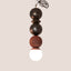 Bronze and Rust Red ceramic Dot Dot Dot pendant, J Schatz.