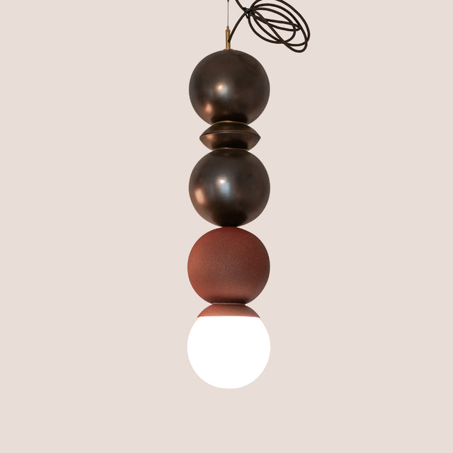 Bronze and Rust Red ceramic Dot Dot Dot pendant, J Schatz.