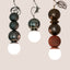 Metallic Edition Dot Dot Dot ceramic pendants in Graphite, Metallic Black, and Bronze, J Schatz.