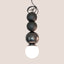 Graphite and Metallic Black ceramic Dot Dot Dot pendant, J Schatz.