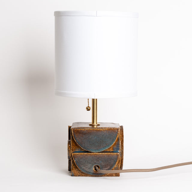 Geometria ceramic table lamp in cocoa blue metallic, lit, J Schatz