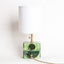 Geometria ceramic table lamp in sage green metallic, lit, J Schatz