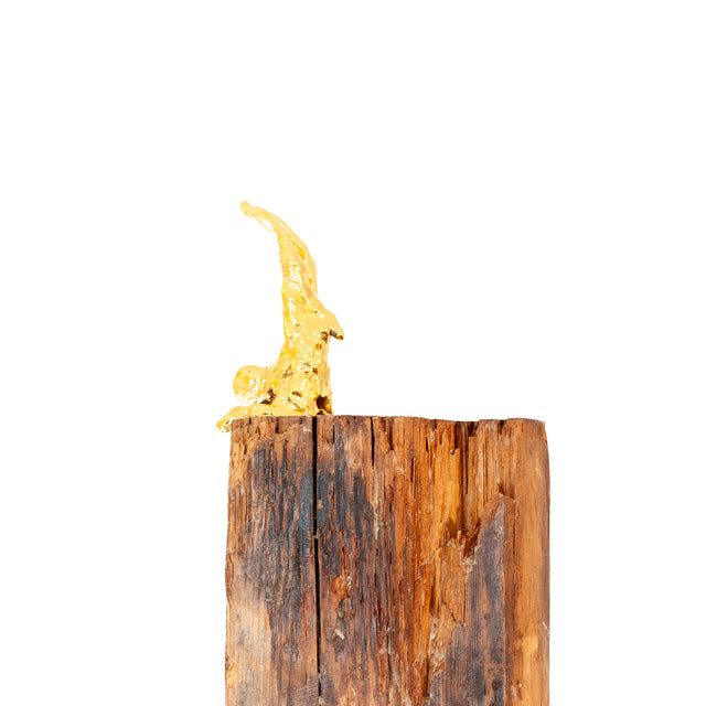 Handstand, alternate view, gold lustre ceramic figure on a weathered wood base by Jim Schatz