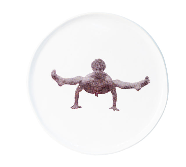 Photographic transfer of a wide squat with arms braced on stoneware Gestures plate, J Schatz.