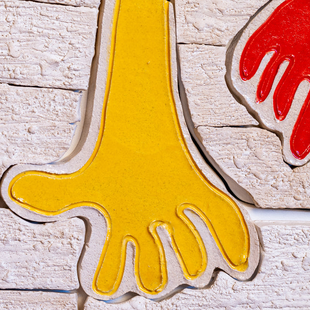 Hold It All Together Mural by Jim Schatz, yellow and blue hand detail