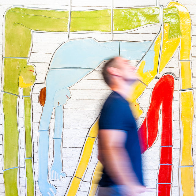 Hold It All Together Mural by Jim Schatz, shown in scale with the artist