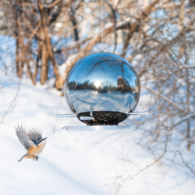 platinum mirror ceramic Pop bird feeder with chickadee in winter trees, J Schatz