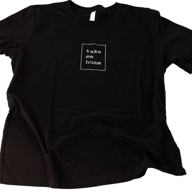 Take Me Home black t-shirt with white screen print, flat lay, J Schatz