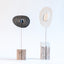 Zen sculptures, paired stoneware forms on carved wood bases, by Jim Schatz and Peter Souza Jr.