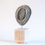 Zen sculpture, stoneware form on a carved wood base, by Jim Schatz and Peter Souza Jr.