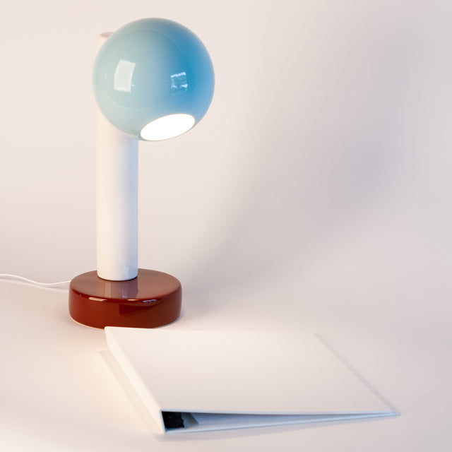 Spot On ceramic desk lamp in light aqua, bright white, and walnut brown, side view, J Schatz