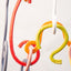 Doodle Mobile, hanging stoneware mobile of glazed extrusions, by Jim Schatz