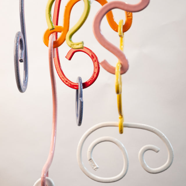 Doodle Mobile, detail of two-sided glazed stoneware extrusions, by Jim Schatz