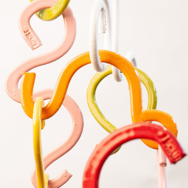 Doodle Mobile, detail of two-sided glazed stoneware extrusions, by Jim Schatz