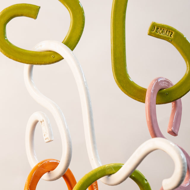 Doodle Mobile, detail of two-sided glazed stoneware extrusions, by Jim Schatz