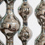 Happening Circle, detail of mirror-finished platinum stoneware shapes, by Jim Schatz