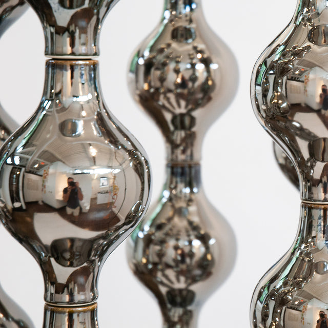 Happening Circle, detail of mirror-finished platinum stoneware shapes, by Jim Schatz