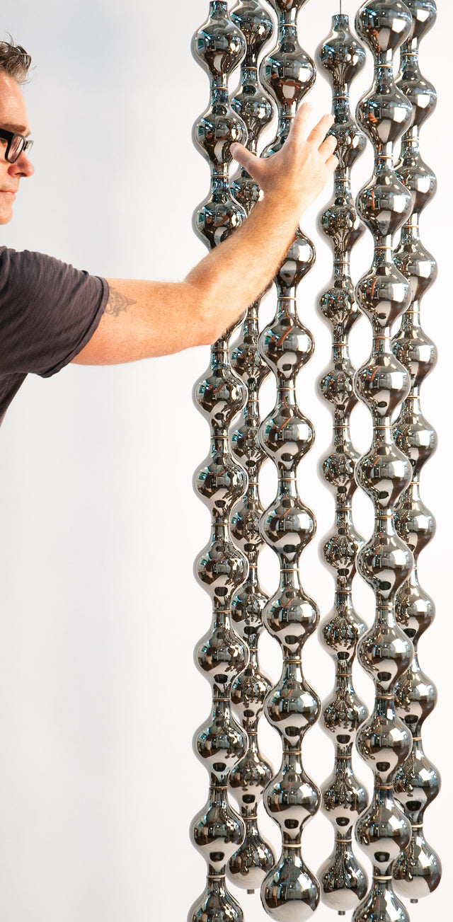 Happening Circle, detail of mirror-finished platinum stoneware shapes, by Jim Schatz