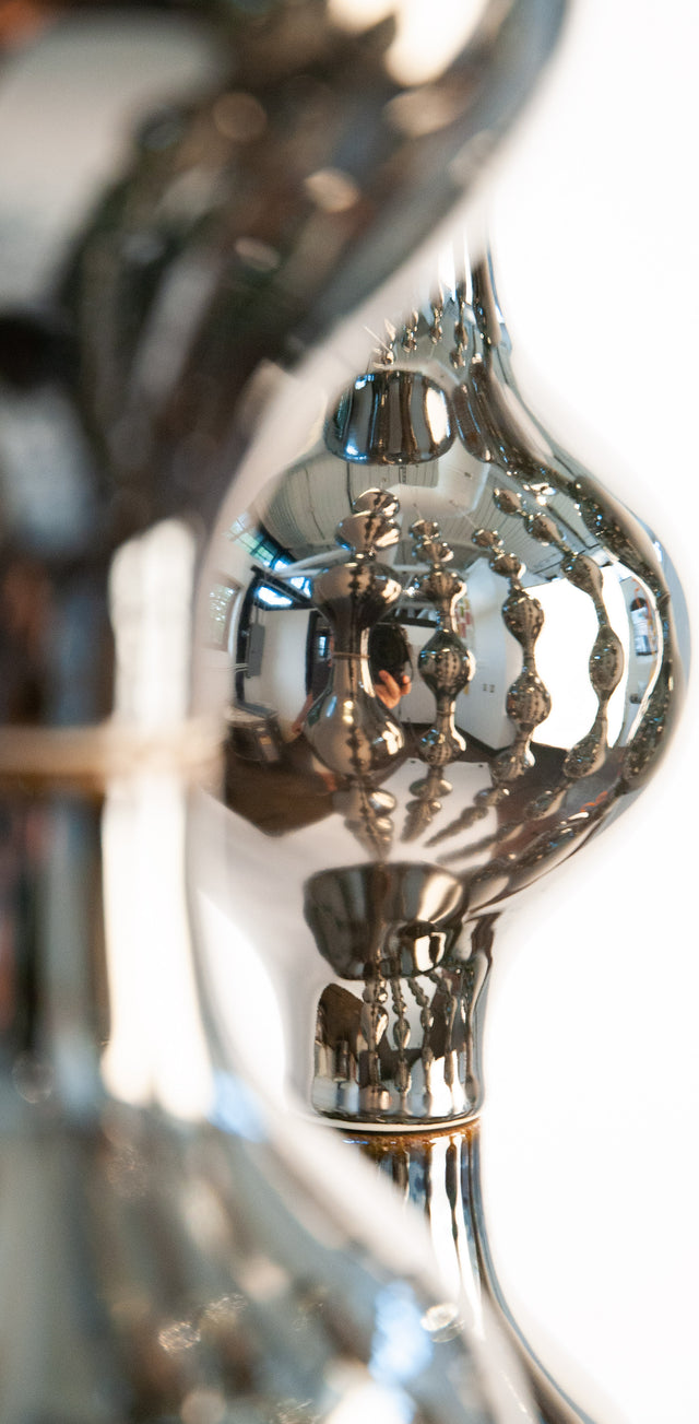 Happening Circle, detail of mirror-finished platinum stoneware shapes, by Jim Schatz