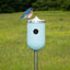 bluebird perched on light aqua ceramic Nut bird house cover, J Schatz