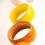 Multicolor Orb Sculpture, detail of glossy stoneware orbs, by Jim Schatz