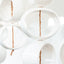 White Orb Sculpture, detail of glossy white stoneware orbs, by Jim Schatz