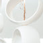 White Orb Sculpture, detail of glossy white stoneware orbs, by Jim Schatz