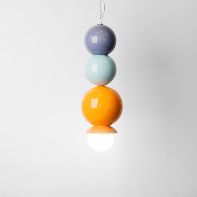 Jacaranda purple, light aqua, and orange peel ceramic Dot Dot Dot pendant, J Schatz.
