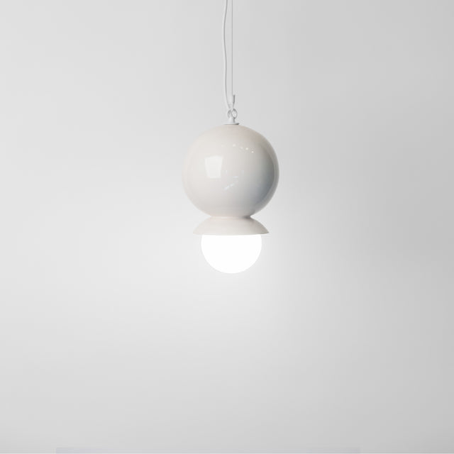 Bright white ceramic Dot Dot Dot pendant, J Schatz.